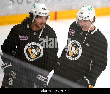 Pittsburgh Penguins Kris Letang left wearing a mullet wig shares a laugh with former Penguin Jaromir Jagr during a team workout in Cranberry Pa. Jagr who spent 11 seasons playing for the