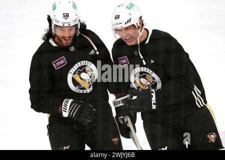 Pittsburgh Penguins Kris Letang left shares a laugh wearing a mullet wig with former Penguin Jaromir Jagr during a team workout in Cranberry Pa. Saturday Feb. 17 2024. Jagr who spent 11 seasons playin...