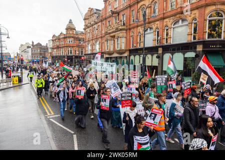 Leeds, UK. 17 FEB, 2024. Pro Palestine protestors march through the city center in Leeds as they escorted by police officers. Credit Milo Chandler/Alamy Live News Stock Photo