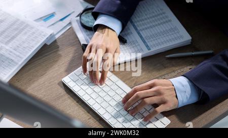 Working in a business center, working at a computer Stock Photo