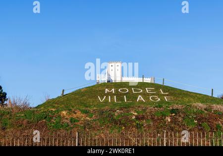 Advertisement for the Model Village, a popular attraction in Southsea, Portsmouth, Hampshire, a holiday resort on the Solent, south coast England Stock Photo