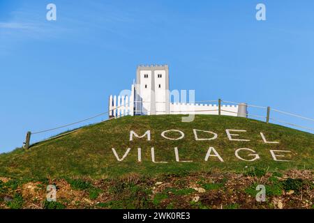 Advertisement for the Model Village, a popular attraction in Southsea, Portsmouth, Hampshire, a holiday resort on the Solent, south coast England Stock Photo