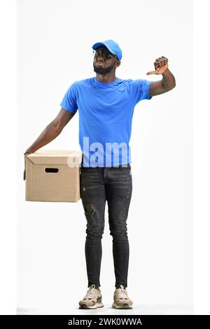 The deliveryman, in full height, on a white background, shows a thumbs up Stock Photo