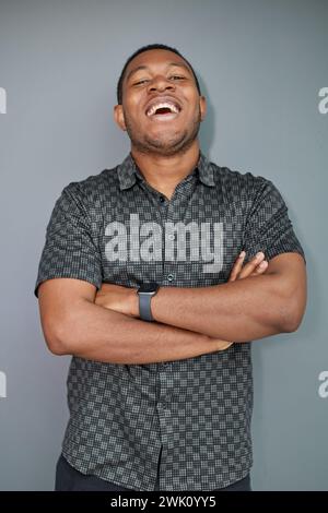 Portrait of an attractive cool guy on a gray background Stock Photo