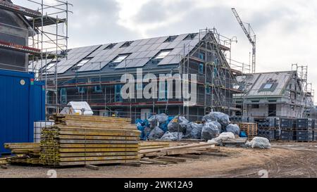 Photo of an empty building under construction with piles of wood Stock Photo