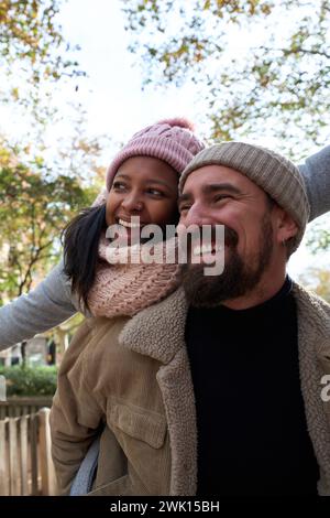 Close-up portrait of beautiful multiracial happy couple outdoor, young woman and man in love Stock Photo