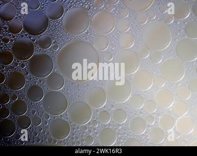 Clear broth surface, close up. Clear soup background. Texture of bubbles in the fluid Stock Photo