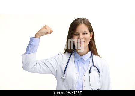 Female doctor, close-up, on a white background, shows strength Stock Photo