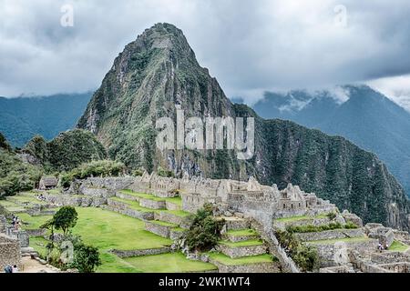 Postcard view of the supposed royal palace of Machu Picchu with the mountain of Huayna Picchu and clouds in the background. Stock Photo