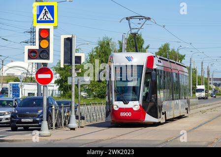 SAINT PETERSBURG, RUSSIA - JUNE 04, 2021: Tram 71-801 (Alstom Citadis 301 CIS) at a traffic light on a sunny June day Stock Photo