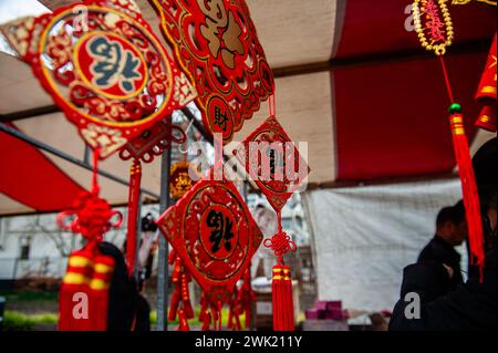 Chinese decorations are seen hanging in one of the market stalls. Lion dancers and dragon dancers parade through the streets of Rotterdam to bless the new year entrepreneurs. The lion dance ceremony ensures that evil spirits are chased away and brings prosperity and happiness for the new year. Chinese communities around the world welcomed the Year of the Dragon on Tuesday, ushering in the Lunar New Year with prayers, family feasts, and shopping sprees. It is an annual 15-day festival that begins with the new moon between Jan. 21 and Feb. 20 in Western calendars. (Photo by Ana Fernandez/SOPA Stock Photo