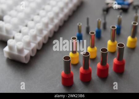 Close up several Wire Ferrule and terminal block w wire on top of a black table Stock Photo