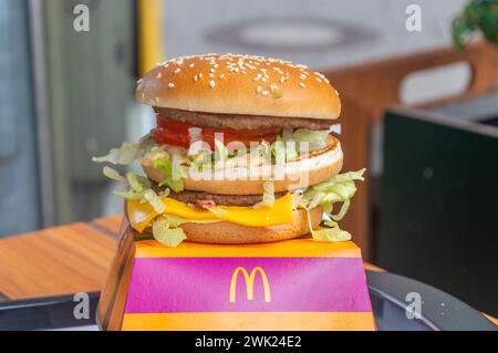 Hanover, Germany - July 29, 2023: McDonald's Big Mac Bacon TS burger. Big Mac with bacon at tomato. Stock Photo