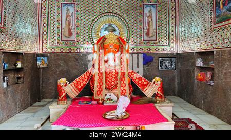 Hindu God Ganesha sclupture over pink background. Celebrate Lord Ganesha festival. Stock Photo