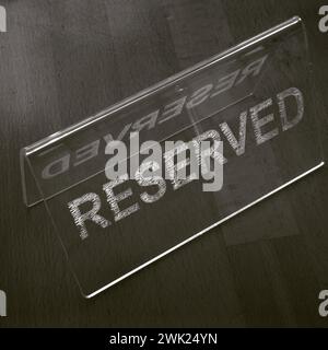 Monochrome Minimalism. Reserved Plastic Sign, on table. Black and white ...