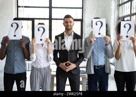 Competitive male candidate among weaker job applicants Stock Photo