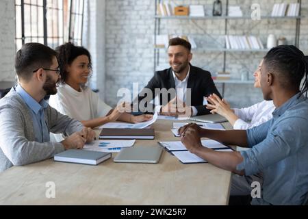 Positive young office workers having a meeting Stock Photo