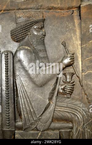 227. LIMESTONE RELIEF OF KING DARIUS SEATED ON THRONE,  PERSEPOLIS, CA. 5TH. C. BC. Stock Photo