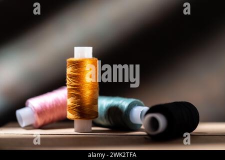 Several spools of thread. Multi-colored spools of thread. Thread for seamstresses. Front view. Stock Photo