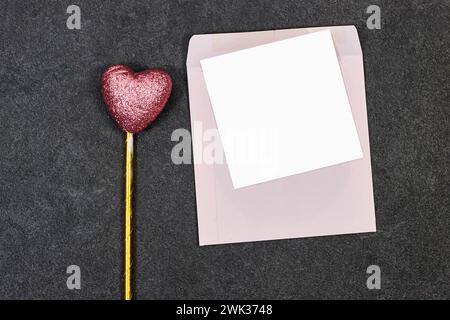 Blank greeting card, flyer or invitation card mockup with Valentines or women's day hearts on grunge gray background Stock Photo