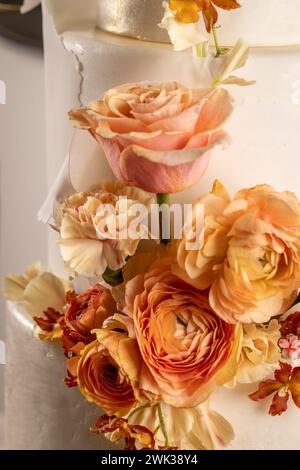 Simple wedding cake with flowers, close up Stock Photo
