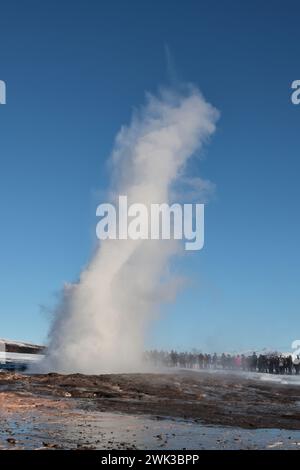 steaming geyser against clear sky in Iceland Stock Photo