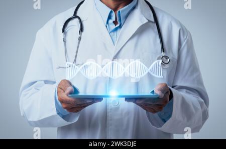 Cropped man doctor hold tablet, online consultation with geneticist Stock Photo
