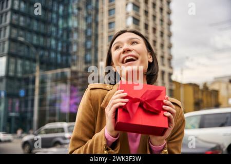 Happy pretty lady very excited receiving present Stock Photo