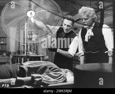 PETER CUSHING and THORLEY WALTERS in a scene from FRANKENSTEIN CREATED WOMAN 1967 Director TERENCE FISHER Writer ANTHONY HINDS Costume Design ROSEMARY BURROWS and LARRY STEWART Music JAMES BERNARD A Hammer Film Production / Warner-Pathe Stock Photo