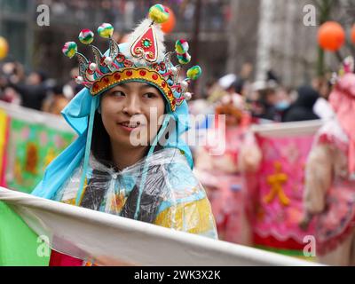 Paris, France, 18th February, 2024. Woman in traditional costume at Chinese New Year - Jacques Julien/Alamy Live News Stock Photo