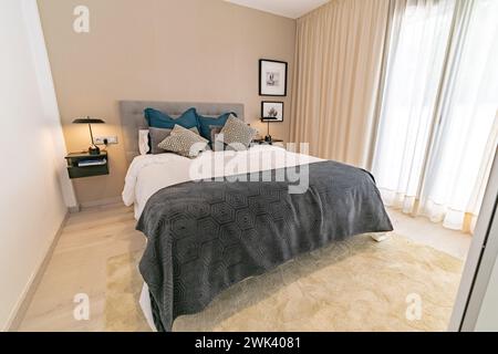 an image of a double bed in a guest bedroom in luxury apartment Stock Photo