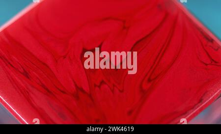 Liquid paint background red waves square surface Stock Photo