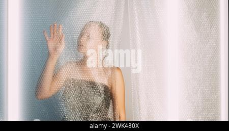Plastic reuse problem woman silhouette bubble wrap Stock Photo