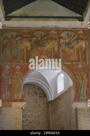 Spain, Toledo. Church of San Román. Built in Mudejar style in the 13th century. Paintings on the eastern front of the Nave of the Epistle. In the upper part: Saint Matthew, Saint Mark and Saint Luke, three of the evangelists. They are depicted winged and with their faces changed by their zoomorphic symbol, as they write the Gospels. In the lower part, three Confessors of the Catholic Church: Saint Eugene, Saint Isidore and Saint Gregory. Stock Photo