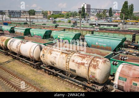 Kyiv, Ukraine - May 27, 2023: Freight railroad cars on a railway station Petrovka. Cargo transportation urban scene, view from above. Stock Photo