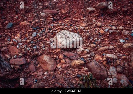 Soil with stones, clay layers photo. Slice of sand with layers of different structures. Layers of sedimentary sandstone rock. High quality picture for Stock Photo