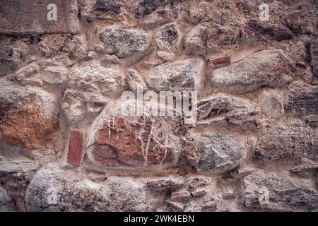 Close up old gray brick texture wall concept photo. Mediterranean architecture, urban city life. District of European town, Barcelona. High quality pi Stock Photo