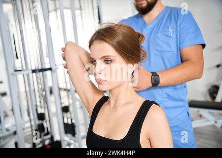 Osteopath works with a patient in the hall Stock Photo