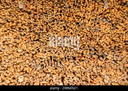 Background of the stacked dry chopped firewood Stock Photo
