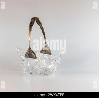 Empty crystal candy bowl on a white background. The vase was made in the mid-20th century. Stock Photo