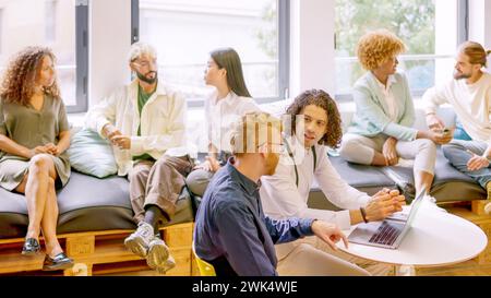 Time to relax during a coffee break in a coworking Stock Photo