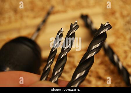 New drill bits of different sizes for drilling wood. Stock Photo