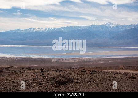 Lake Manly doesn't appear often in Badwater Basin in Death Valley National Park, and is now a popular tourist destination. Stock Photo