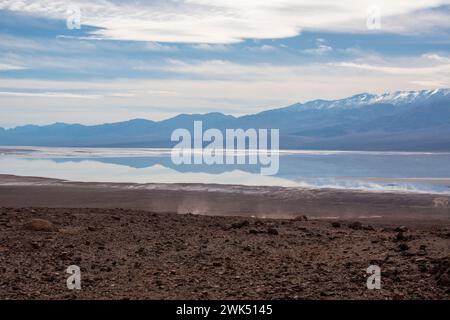 Lake Manly doesn't appear often in Badwater Basin in Death Valley National Park, and is now a popular tourist destination. Stock Photo