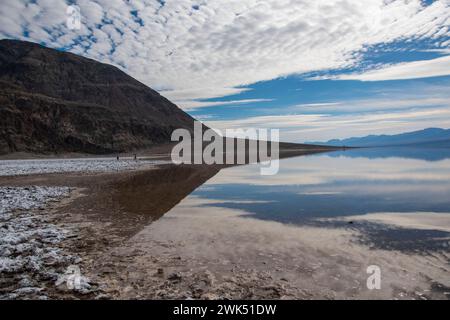 Lake Manly doesn't appear often in Badwater Basin in Death Valley National Park, and is now a popular tourist destination. Stock Photo