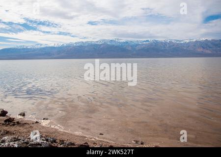 Lake Manly doesn't appear often in Badwater Basin in Death Valley National Park, and is now a popular tourist destination. Stock Photo