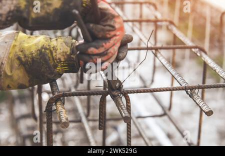 Construction worker steel fixer working at the building  site close-up Stock Photo