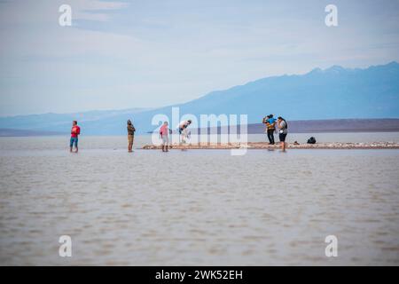 Lake Manly doesn't appear often in Badwater Basin in Death Valley National Park, and is now a popular tourist destination. Stock Photo