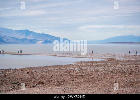 Lake Manly doesn't appear often in Badwater Basin in Death Valley National Park, and is now a popular tourist destination. Stock Photo