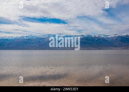 Lake Manly doesn't appear often in Badwater Basin in Death Valley National Park, and is now a popular tourist destination. Stock Photo